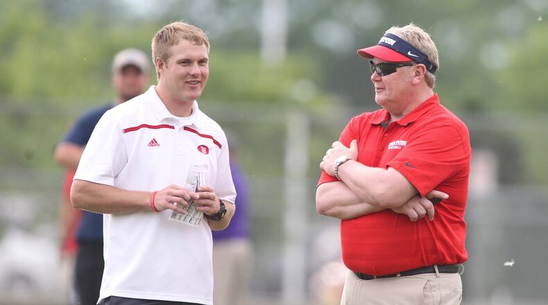 Wittenberg offensive coordinator Kevin Hoyng, left, talks with his former coach, Dayton’s Rick Chamberlin at Michigan’s satellite camp at Springfield High School on June 1, 2016. David Jablonski/Staff