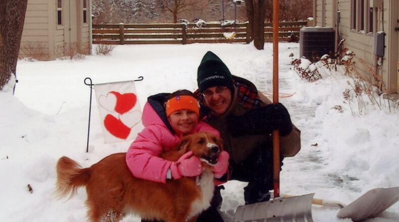 A younger Jordan and Ed playing in the snow with passed dog, Lucy. KARIN SPICER