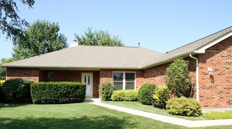 The brick ranch is surrounded by 16 acres of which 14 acres are tillable. A concrete walkway leads from the driveway to the formal entry of the house. CONTRIBUTED PHOTOS BY KATHY TYLER