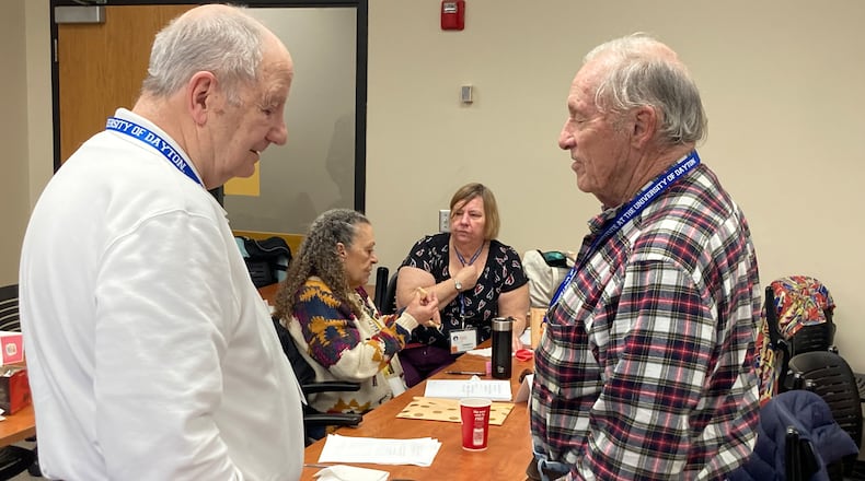 Students work together during the Legacy Writing Seminar at the University of Dayton Left to right: John Bowen, Jackie Huber, Christy Piszkiewicz and Gary Ruff. CONTRIBUTED