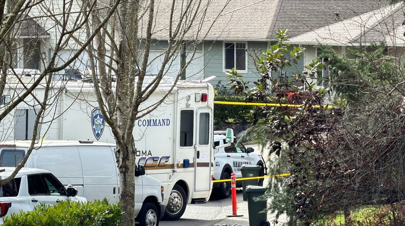Authorities investigate the scene after reports that a person fatally stabbed multiple people on Tuesday, Feb. 24, 2026, in Gig Harbor, Wash. (AP Photo/John Froschauer)