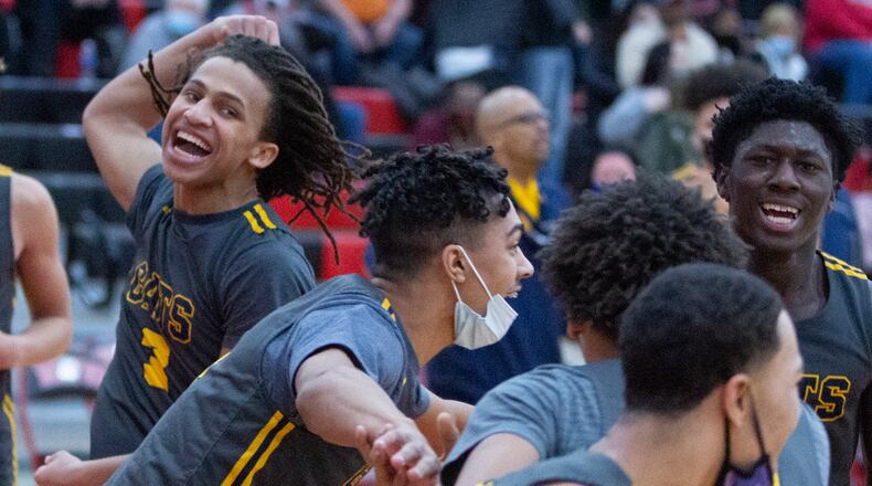 Springfield players celebrate their stunning 59-57 victory at ninth-ranked Wayne Friday night. Jeff Gilbert/CONTRIBUTED
