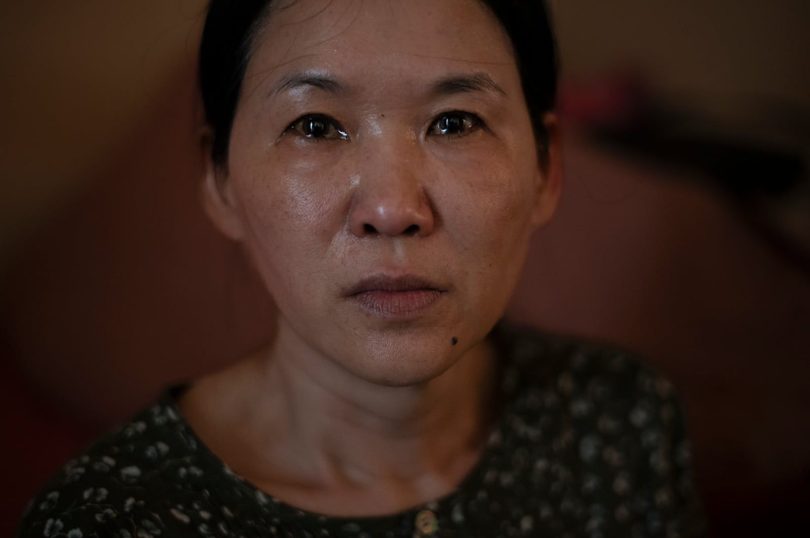 FILE - Yooree Kim, who was 11 when she was sent by an adoption agency to a couple in France, sits for a portrait as tears well up in her eyes in her apartment in Seoul, South Korea, Sunday, May 19, 2024. (AP Photo/Jae C. Hong, File)