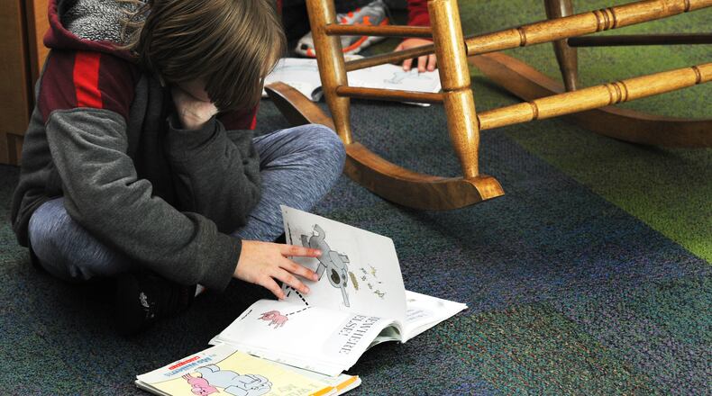Charles Huber Elementary student Zane Railey reads a book in class Thursday Nov. 3, 2022. MARSHALL GORBY\STAFF