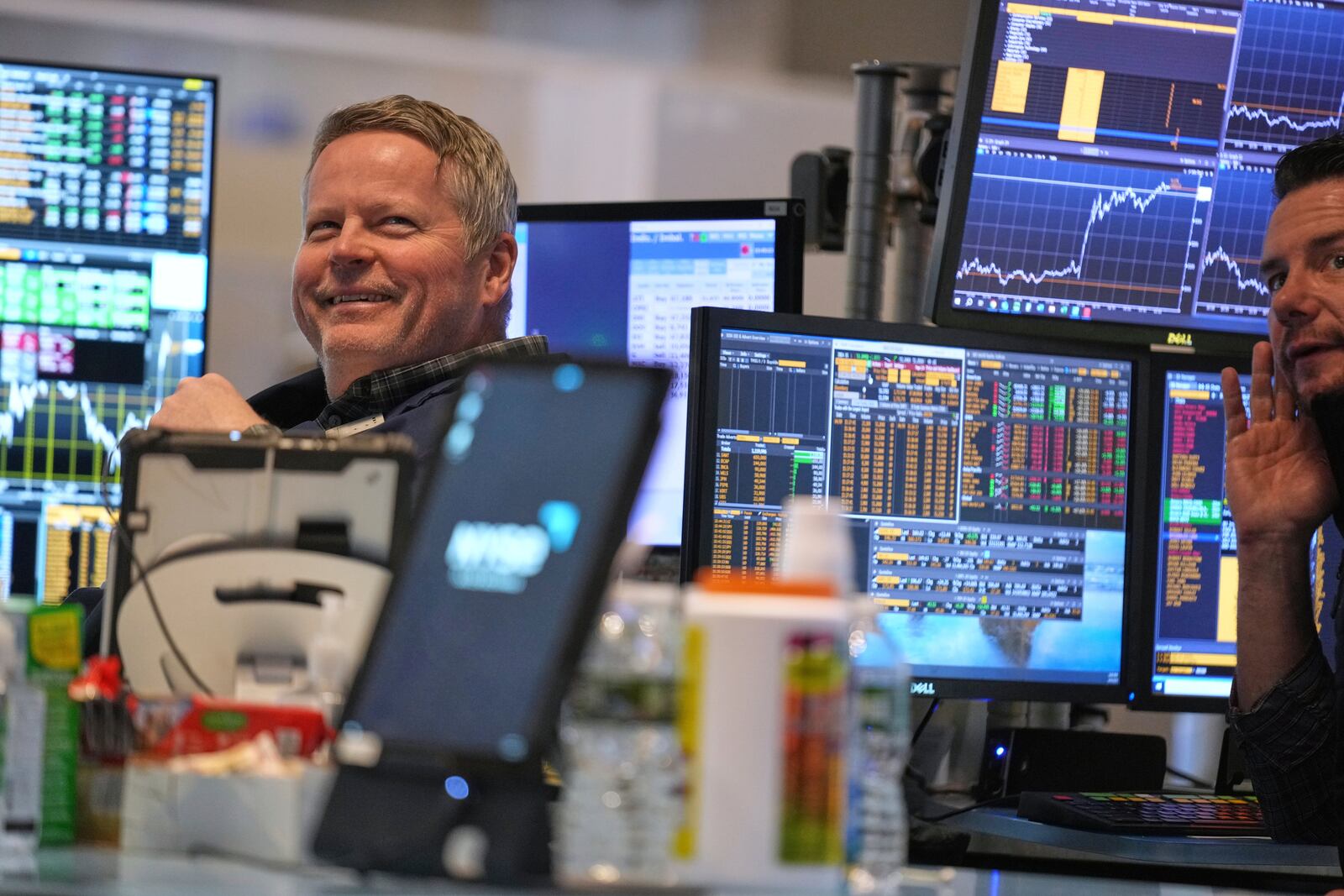 People work on the floor at the New York Stock Exchange in New York, Wednesday, April 9, 2025. (AP Photo/Seth Wenig)
