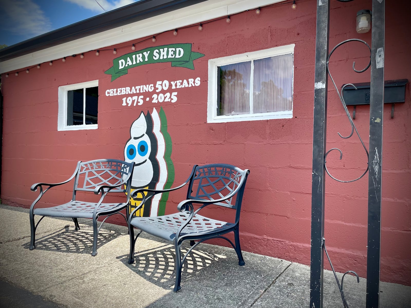 A local girl scout troop painted a mural on the side of the Dairy Shed to celebrate 50 years in Bellbrook. NATALIE JONES/STAFF
