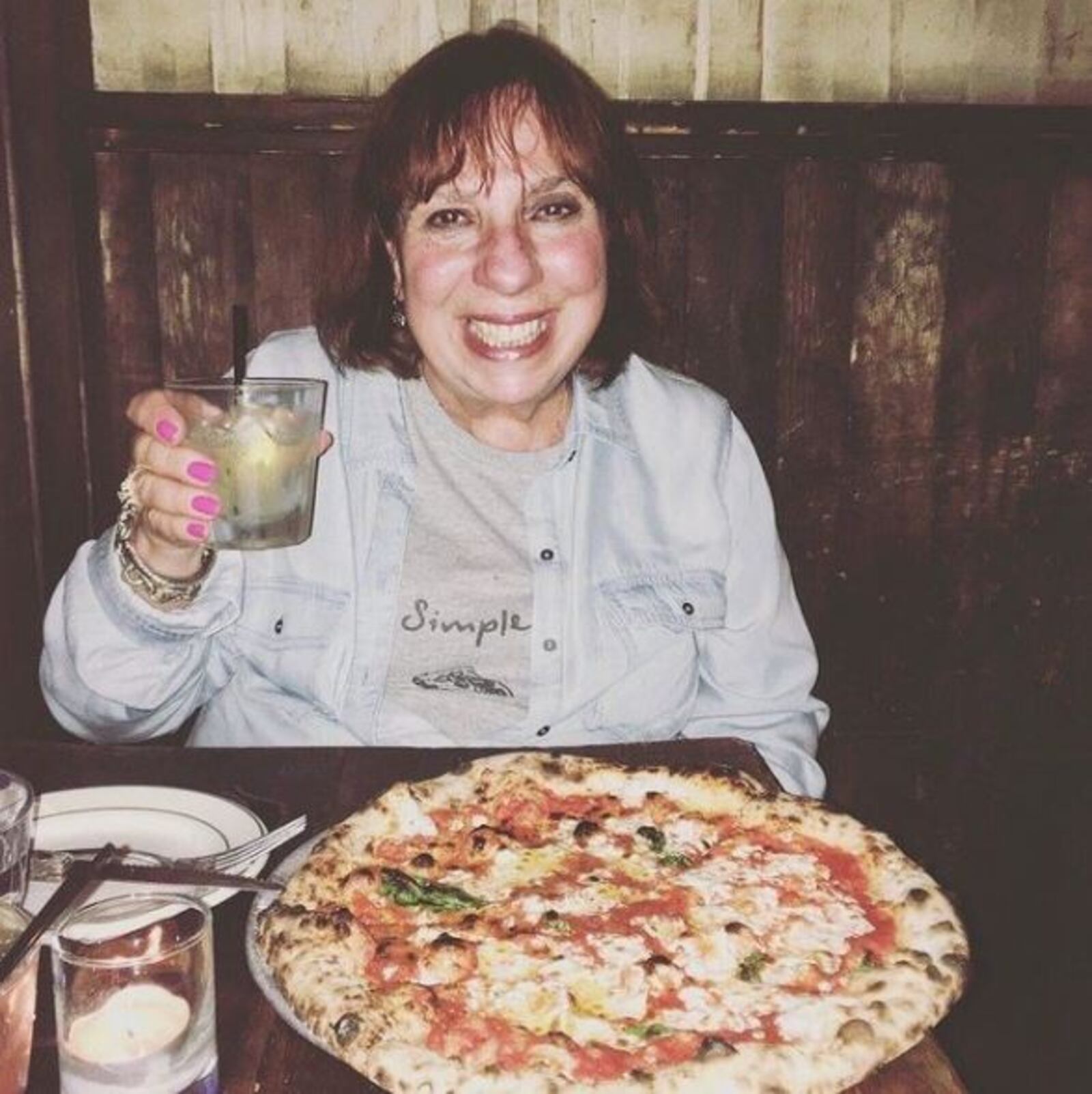 Miriam Weiskind's mother, Hyla Weiskind enjoying a pizza.