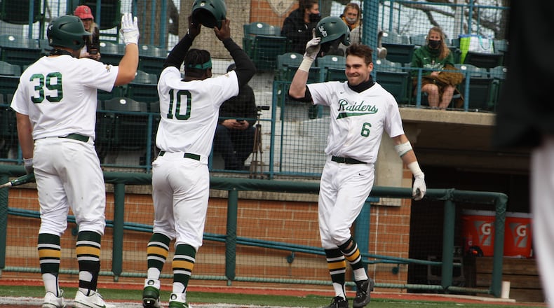 Wright State's Tyler Black (6) celebrates a home run with teammates Quincy Hamilton (10) and Zane Harris during a game against Youngstown State. Wright State Athletics photo