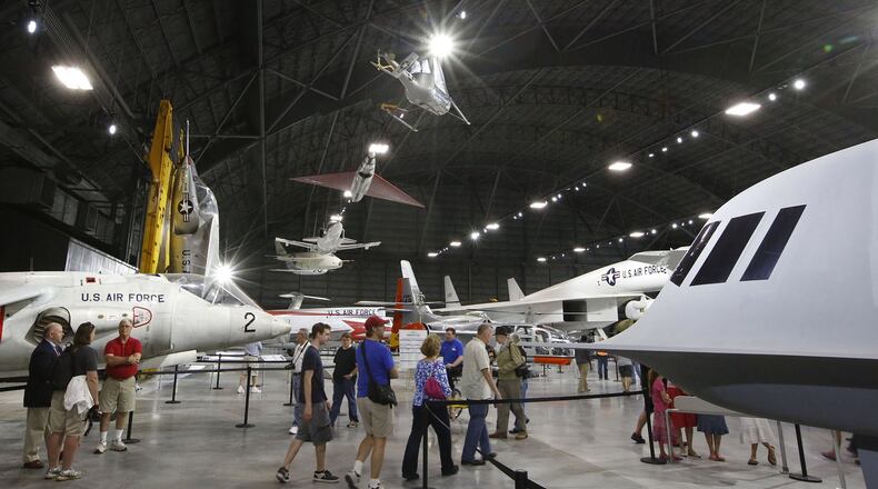Top Air Force officials attending the annual Corona Top conference at Wright-Patterson Air Force Base took part in the opening of the new fourth building at the National Museum of the U.S. Air Force. A watchdog group has questioned the costs of conference, which attracted 60 generals and a large support staff. TY GREENLEES / STAFF