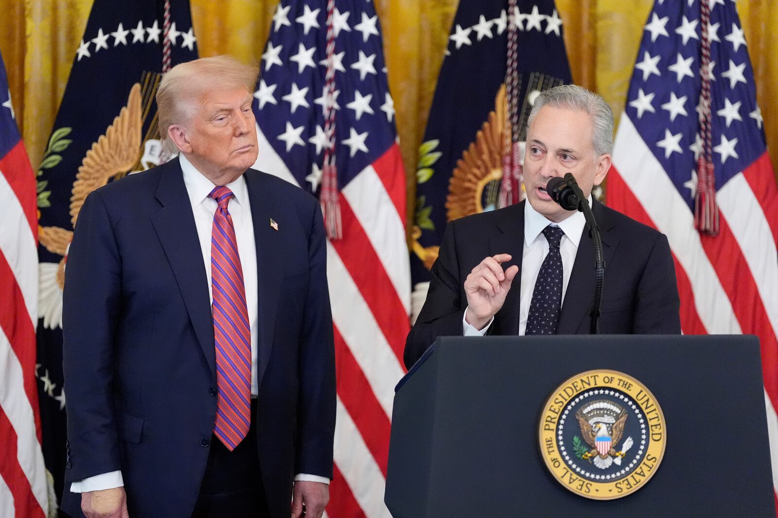 White House AI and crypto czar David Sacks speaks as President Donald Trump listens at an event for the signing of the GENIUS Act, a bill that regulates stablecoins, a type of cryptocurrency, in the East Room of the White House, Friday, July 18, 2025, in Washington. (AP Photo/Alex Brandon)