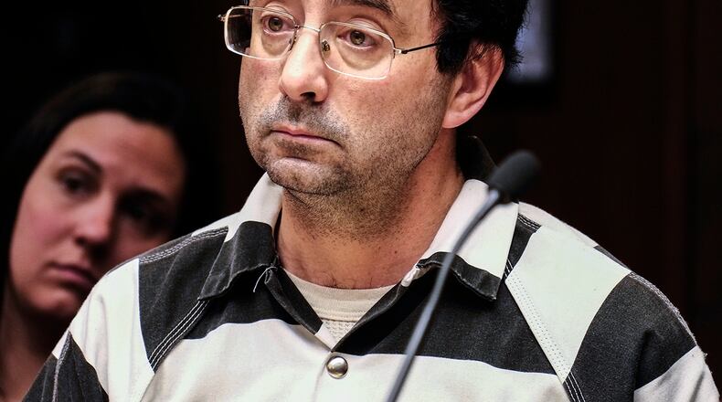 FILE - In this Feb. 17, 2017, file photo, Michigan sport doctor Larry Nassar listens to testimony of a witness during a preliminary hearing, in Lansing, Mich. A judge on Friday, April 14, 2017, has barred the public from the courtroom when two women and a teenage girl are expected to testify in June that Nassar sexually assaulted them during medical appointments. (Robert Killips /Lansing State Journal via AP, File)