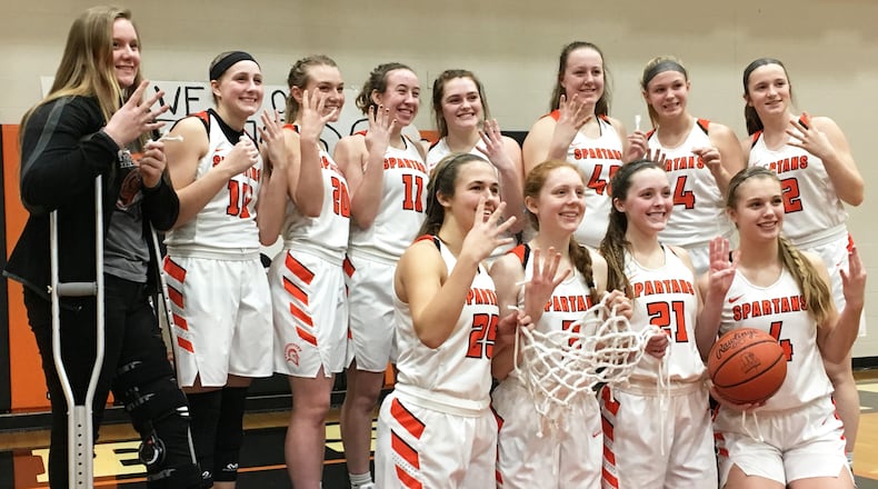 The Waynesville girls basketball team celebrates a win. RICK CASSANO/STAFF