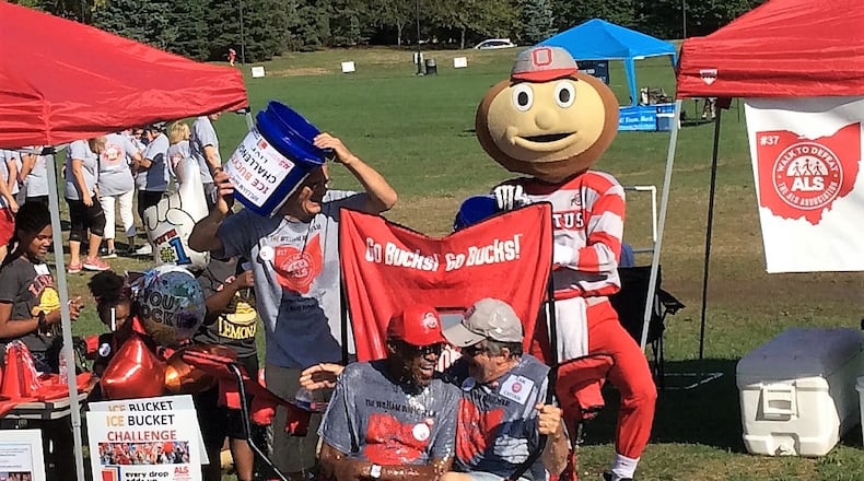 Former Ohio State football player William White, left in OSU hat, took the ice bucket challenge last year and this year will be joined by several former Buckeye coaches and players to raise money for the local ALS chapter. White has suffered with the disease for three years. CONTRIBUTED
