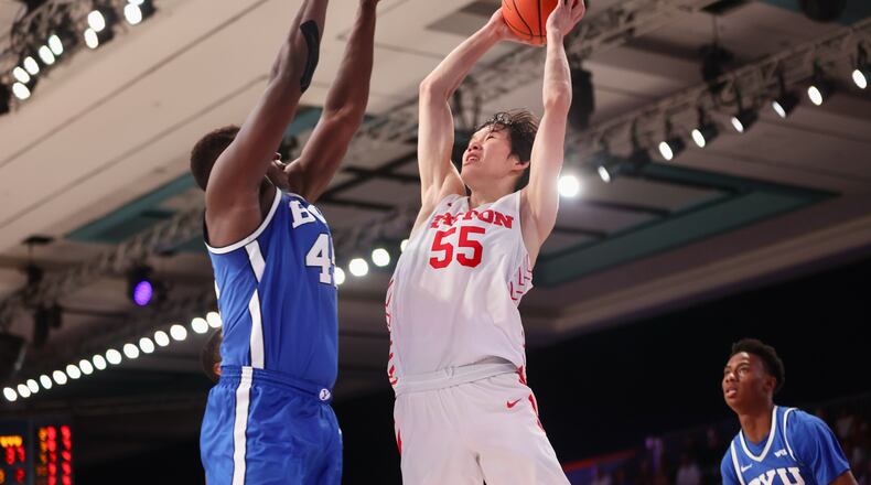 Dayton's Mike Sharavjamts shoots in the second half during a game against BYU in the Battle 4 Atlantis on Friday, Nov. 25, in Nassau, Bahamas. David Jablonski/Staff
