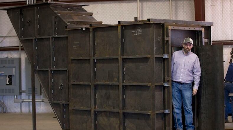 Gary Lynch with a bomb shelter under construction at Rising S Co. (Joyce Marshall/Fort Worth Star-Telegram/TNS)