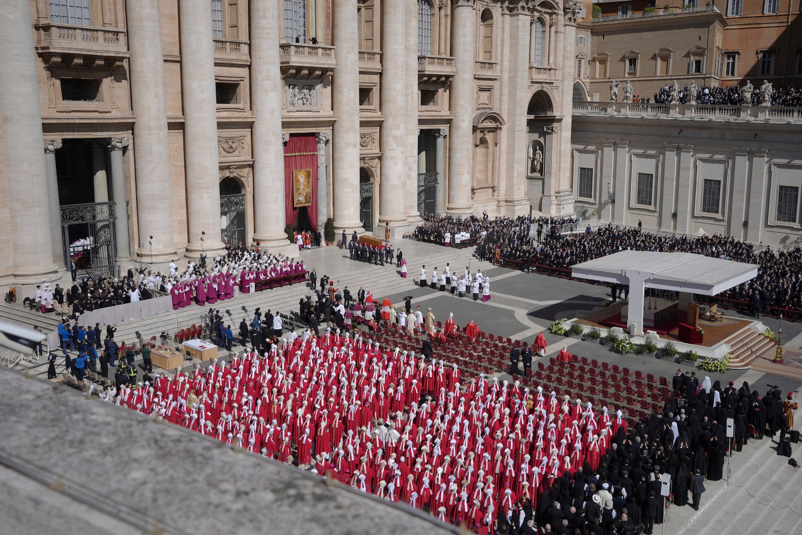 Pallbearers carry the coffin during the funeral of Pope Francis in St. Peter's Square at the Vatican, Saturday, April 26, 2025. (AP Photo/Markus Schreiber)