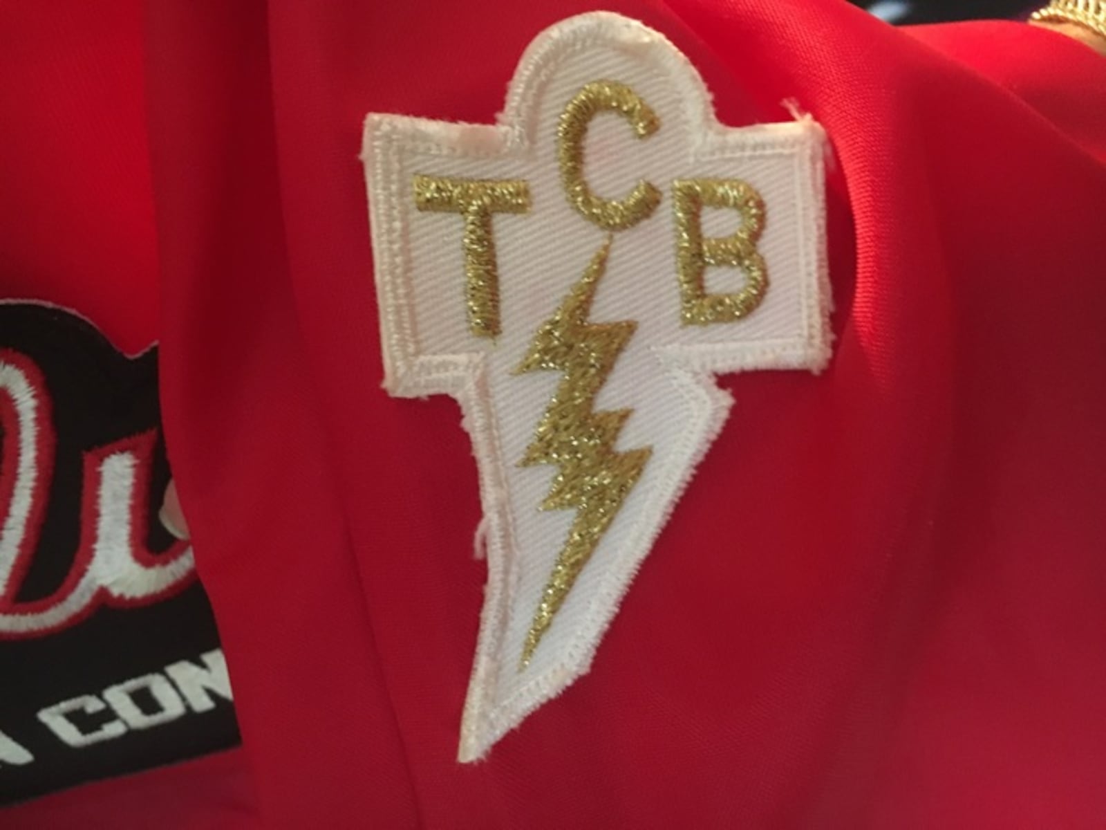 The "Taking Care Of Business" insignia from an Elvis Presley tour jacket.