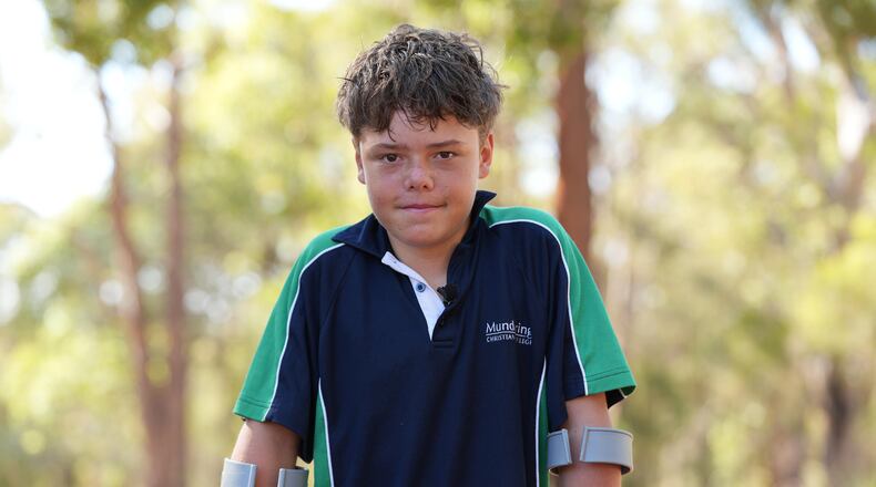 Austin Appelbee poses for a photo in Gidgegannup, Australia, Tuesday Feb. 3, 2026, after the 13-year-old made an hourslong swim to raise an alarm after his family was swept out to sea off the Australian coast. (Briana Shepherd/ABC via AP)