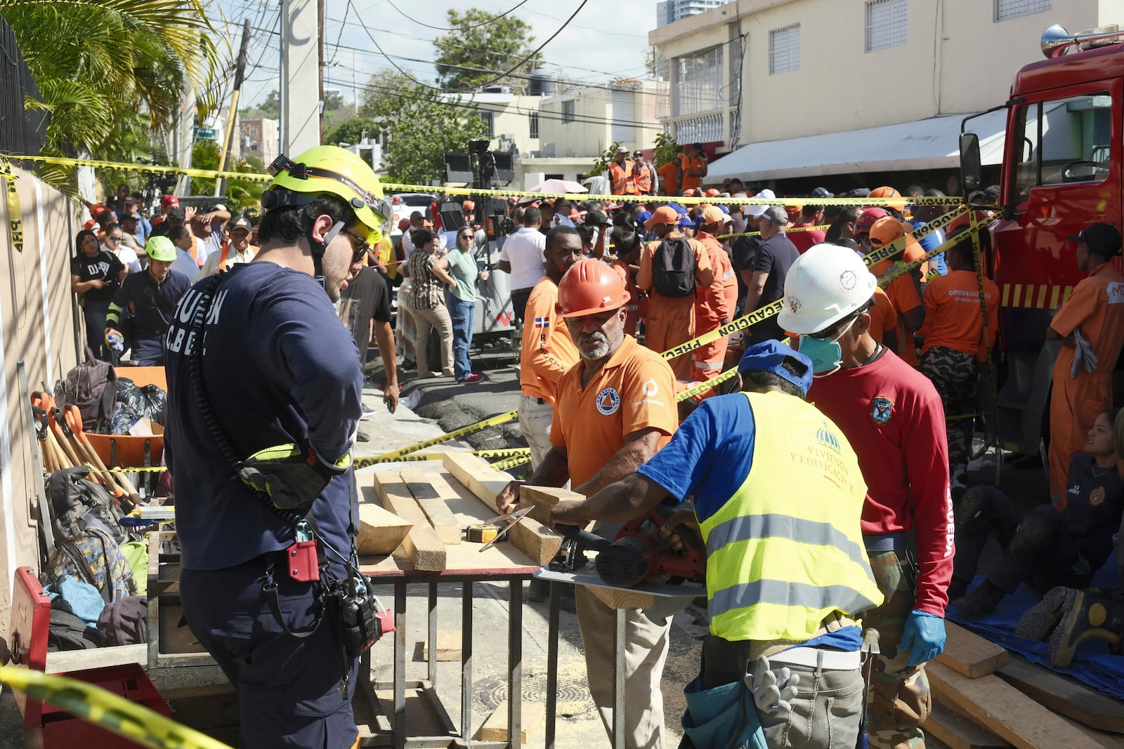 Workers search for survivors at the Jet Set nightclub after its roof collapsed during a merengue concert in Santo Domingo, Dominican Republic, Tuesday, April 8, 2025.(AP Photo/Ricardo Hernandez)
