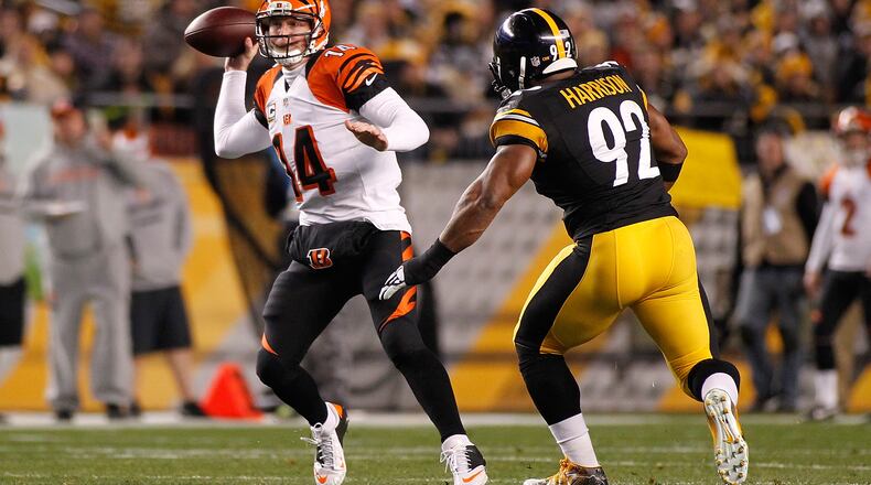 PITTSBURGH, PA - DECEMBER 28: Andy Dalton #14 of the Cincinnati Bengals throws a pass in front of James Harrison #92 of the Pittsburgh Steelers during the first quarter at Heinz Field on December 28, 2014 in Pittsburgh, Pennsylvania. (Photo by Justin K. Aller/Getty Images)