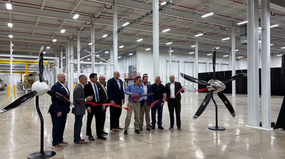 Hartzell Propeller employees and allies cut the ribbon on the company's new Propeller Innovation Center in Piqua Friday Feb. 20, 2026. THOMAS GNAU/STAFF