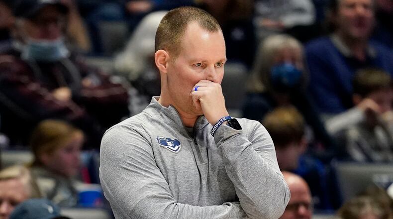 Xavier coach Travis Steele stands next to the home bench during the second half of an NCAA college basketball game against DePaul, Saturday, Feb. 5, 2022, in Cincinnati. (AP Photo/Jeff Dean)