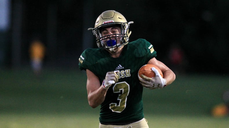 Catholic Central's Ashton Young runs for a touchdown against West Jefferson at Hallinean Field on Friday, Sept. 17, 2021, in Springfield. David Jablonsk/Staff