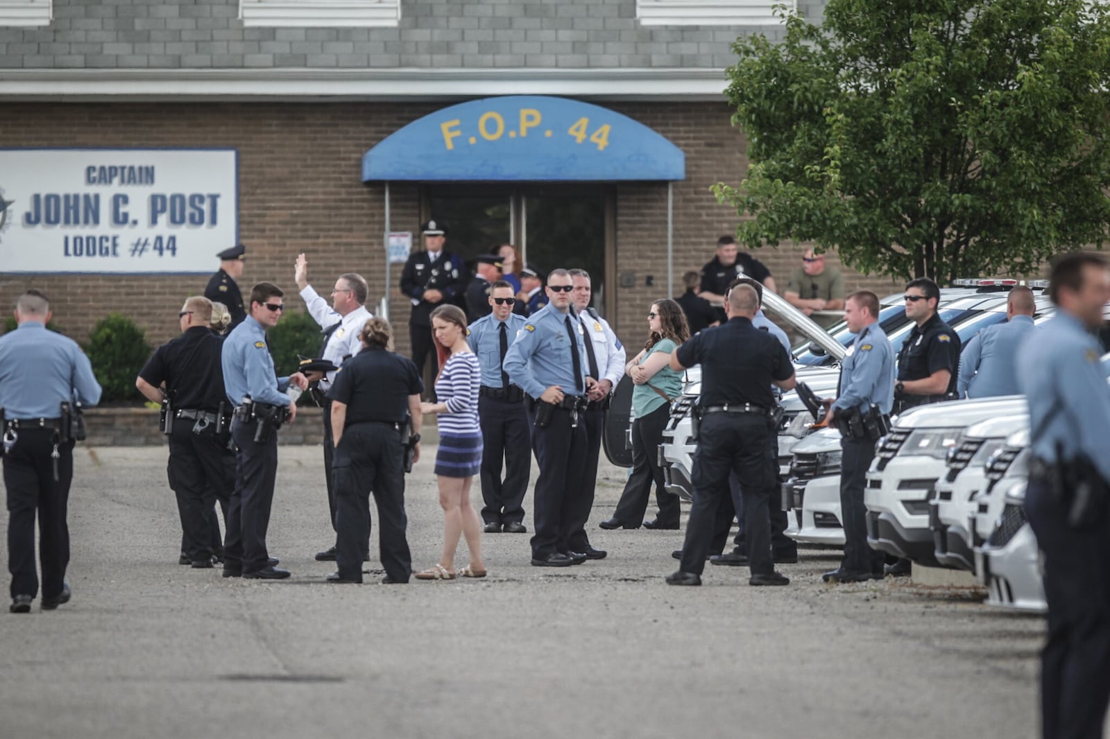 In June 2020, the Dayton Police Department and the Canine Unit put to rest K9 Phantom at the FOP on Powell Road. K9s and their officers lined the drive to the lodge. At the entrance of the drive was a large American flag, an honor paid by the Dayton Fire Department. Phantom was the third partner of longtime Canine Unit Officer Rob Cleaver. JIM NOELKER/STAFF