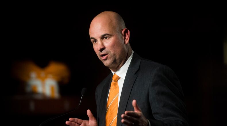 In this Dec. 7, 2017, file photo, Tennessee head coach Jeremy Pruitt speaks at his introduction ceremony in Knoxville, Tenn. Pruitt doesn’t have to split time between two jobs anymore. After serving as Alabama’s defensive coordinator during the Crimson Tide’s national championship run, Pruitt is back in Knoxville beginning the challenge of returning Tennessee to Southeastern Conference contention. (Caitie McMekin/Knoxville News Sentinel via AP, File)