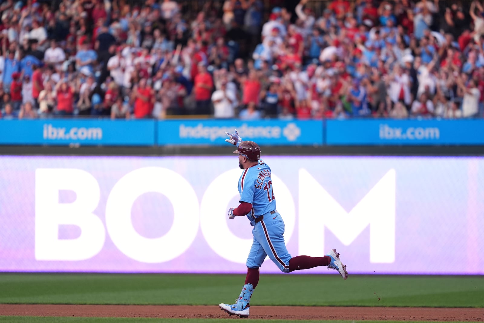 Philadelphia Phillies' Kyle Schwarber reacts after hitting a home run against Atlanta Braves pitcher Cal Quantrill during the first inning of a baseball game Thursday, Aug. 28, 2025, in Philadelphia. (AP Photo/Matt Slocum)