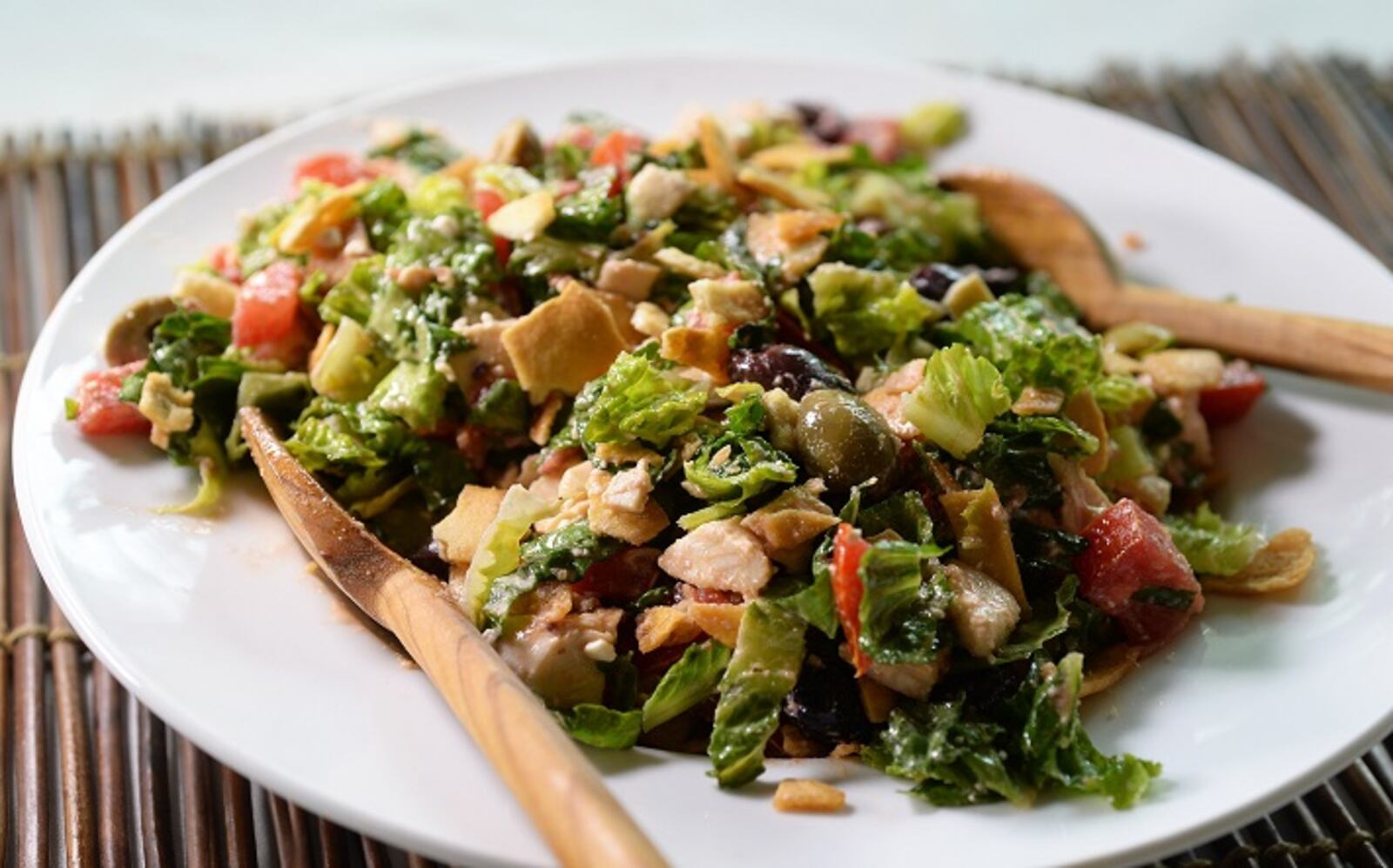 Greek chicken salad is finished off with crumbled pita chips. (Diedra Laird/Charlotte Observer/TNS)