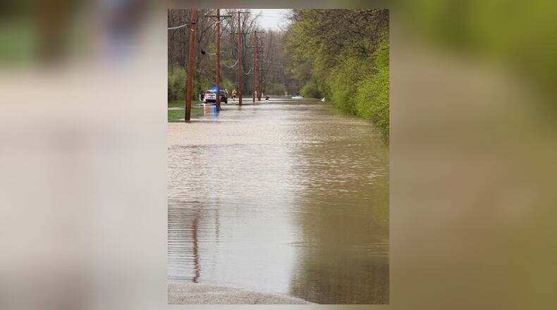 A family was rescued by first responders Sunday after driving past signs warning of high waters ahead. CONTRIBUTED