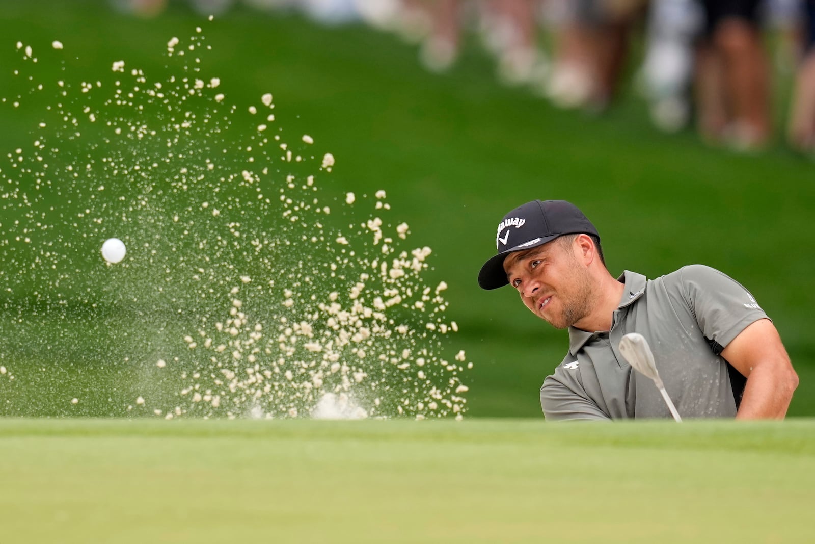 Xander Schauffele hits from the bunker on the sixth hole during the second round of the PGA Championship golf tournament at the Quail Hollow Club, Friday, May 16, 2025, in Charlotte, N.C. (AP Photo/David J. Phillip)