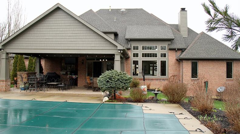Outdoor entertainment was added in 2009. The space put a cathedral roof with skylights over the paver-brick patio. A stone gas fireplace was added. Concrete surrounds the in-ground swimming pool and extends to include a basketball half-court.