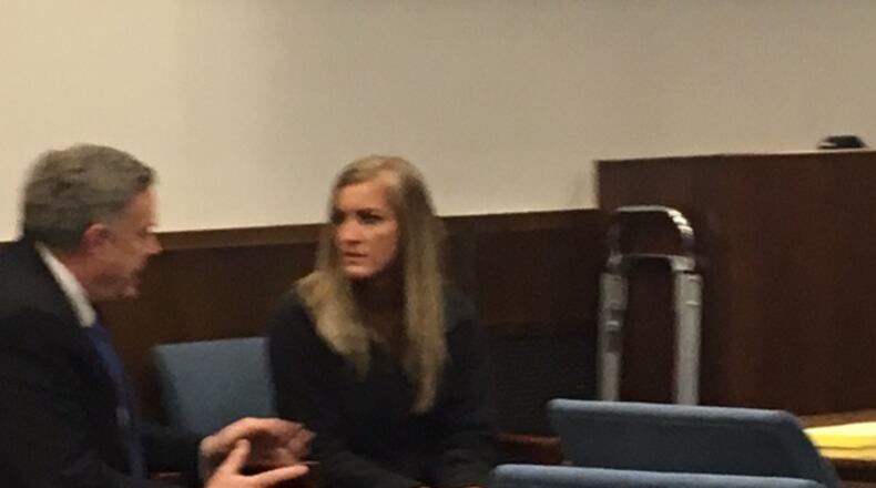 Jessica Langford and defense attorney Lawrence Greger talk Wednesday in the courtroom. NICK BLIZZARD/STAFF