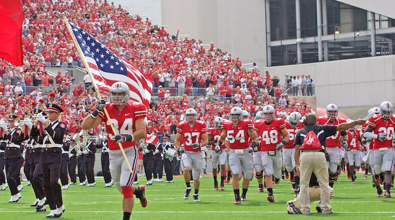 Ohio State Buckeyes defensive back Nate Ebner (34) leads the Ohio State Buckeyes onto the field prior to the game between Toledo and Ohio State at Ohio Stadium, Columbus, Ohio. Ohio State defeated Toledo 27-22.