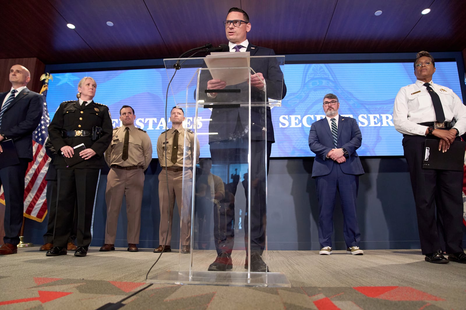 Matt McCool, Special Agent in Charge with the U.S. Secret Service Washington Field Office, speaks during a Public safety briefing on preparations for a festival and parade to commemorate the 250th Birthday of the U.S. Army, with at far left,Phillip Bates, Special Agent in Charge of the FBI Washington Field Office Mission Services Division, and Jessica Taylor, Chief of the U.S. Park Police, and at right Clint Osborn, Director of the DC Homeland Security and Emergency Management Agency, and Pamela Smith, Chief of the Metropolitan Police Department, Monday, June 9, 2025, at the DC Homeland Security and Emergency Management Agency Emergency Operations Center, in Washington. (AP Photo/Jacquelyn Martin)