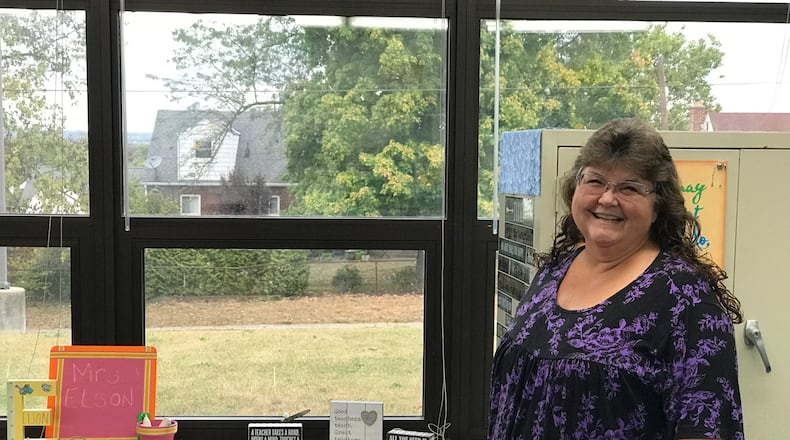 From the windows in her fifth grade classroom at Mound Elementary School, Gina Kinderdine Elson can see the house (with the white dormer) where her great grandfather, Hobby Kinderdine, a standout two-way player and kicker for the Dayton Triangles used to live. He is credited with kicking the first PAT in NFL history when he played in the league’s first ever game at Triangle Park on October 3, 1920. Tom Archdeacon/CONTRIBUTED