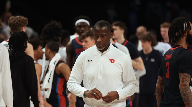 Dayton's Anthony Grant leaves the court after a loss to Duquesne in the Atlantic 10 Conference tournament quarterfinals on Thursday, March 14, 2024, at the Barclays Center in Brooklyn, N.Y. David Jablonski/Staff