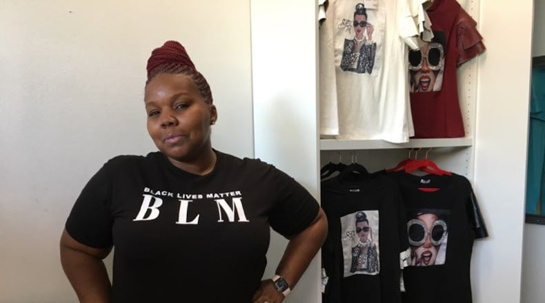 Davia Allen is the owner of the brand new, downtown Dayton fashion store, Vidia's Closet. SARAH FRANKS/STAFF