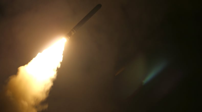 U.S. FIFTH FLEET AREA OF OPERATIONS - APRIL 13: In this handout released by the U.S. Navy, the guided-missile cruiser USS Monterey (CG 61) fires a Tomahawk land attack missile at Syria as part of an allied strike April 13, 2018. Monterey is deployed to the U.S. 5th Fleet area of operations in support of maritime security operations to reassure allies and partners and preserve the freedom of navigation and the free flow of commerce in the region. President Donald Trump has ordered a joint force strike on Syria with Britain and France over the recent suspected chemical attack by Syrian President Bashar al-Assad.(Photo by Matthew Daniels/U.S. Navy via Getty Images)