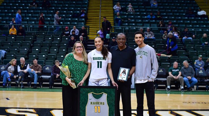 At Wright State’s Senior Day last month at the Nutter Center, Rachel Loobie is flanked by her mom, Susan; dad Patrick; and brother Caleb. Loobie leads the Raiders in rebounds, blocked shots and field goal percentage. Wright State Athletics photo