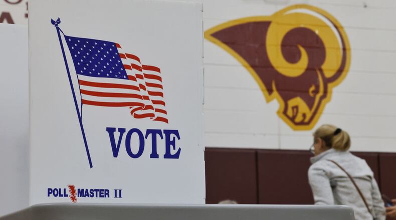 Poll workers check in residents to vote at Elda Elementary School Tuesday, May 2, 2023 in Ross Twp. Residents were voting on a levy for Ross schools. NICK GRAHAM/STAFF