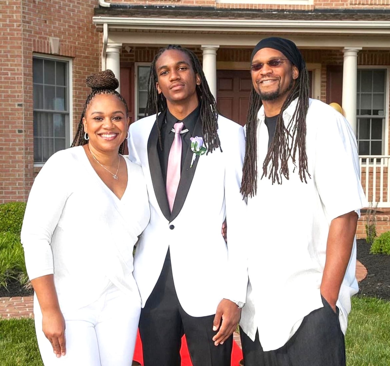 New Dayton Flyer, Malcolm Thomas, a 6-foot-8 transfer from Villanova, is flanked by his parents: mom, Nicole, a former Syracuse women’s basketball star; and dad Etan, who also was a Syracuse standout, became the No. 12 overall pick in the 2000 NBA draft and spent 10 years in the league. CONTRIBUTED PHOTO