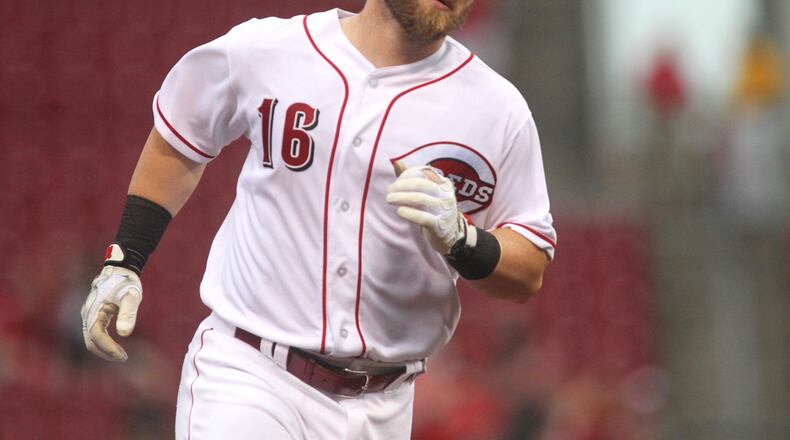 The Reds' Tucker Barnhart rounds the bases after a grand slam in the first inning against the Marlins on Tuesday, Aug. 16, 2016, at Great American Ball Park in Cincinnati. David Jablonski/Staff