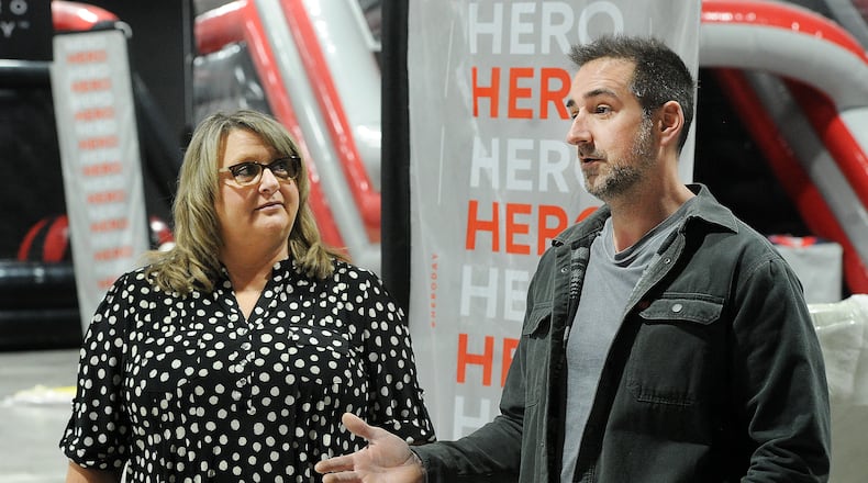 Helga Leep, onsite manager for the Piqua Center, (left) and Brad Gossard, owner of the Hero Day Inflatable Theme Park, (right) talk about features of the Hero Day, an amusement park opening in the Piqua Center in March. The Piqua Center, previously known as the Miami Valley Centre Mall, is planning new experiences for customers in 2024 after the property was acquired by new owners last year. One new business is Hero Day, one of the world's largest indoor action parks for family entertainment and birthday parties. MARSHALL GORBY\STAFF