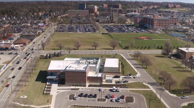 The University of Dayton wants to build a new arts center on vacant land at the southeast corner of East Stewart and South Main street. The proposed site is an empty field, seen here just east and across the street from the Emerson Climate Technologies’ $35 million Helix Innovation Center on UD’s campus. FILE