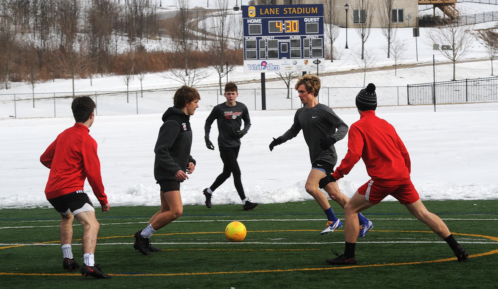PHOTOS: Oakwood soccer players shovel snow to play