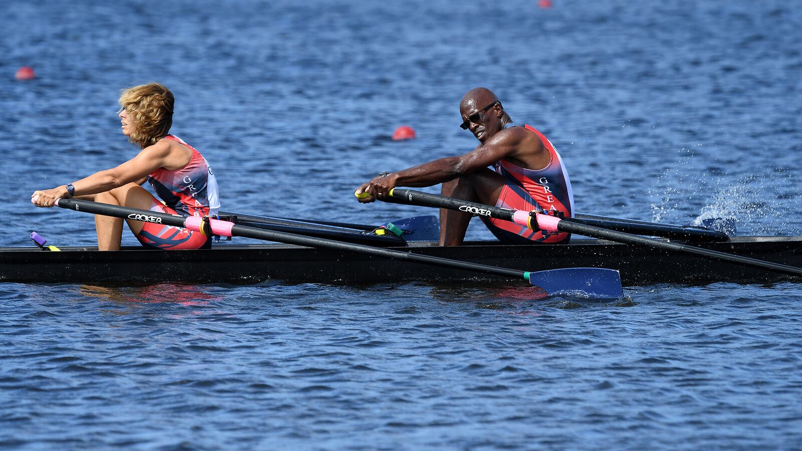 Meg Evans (front) and Brian White (rear) rowing their double boat, named "Mr. Do!" after a video game that played a prominent part in their meeting during college.