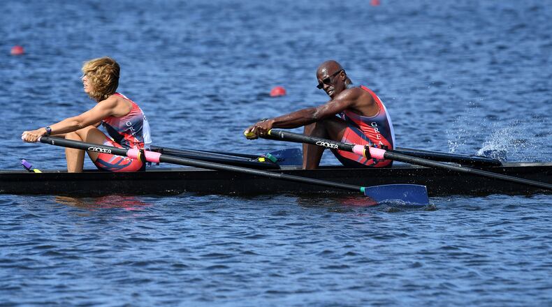 Meg Evans, left, with her husband, Brian White rowing their double boat, named "Mr. Do!" after a video game that played a prominent part in their meeting during college. CONTRIBUTED